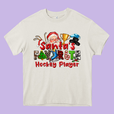 Santas Favorite Hockey Player Heavy Core Tee Designed By Cowgirlartshop