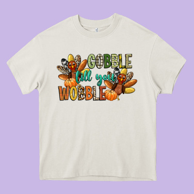Gobble Till You Wobble Heavy Core Tee Designed By Cowgirlartshop