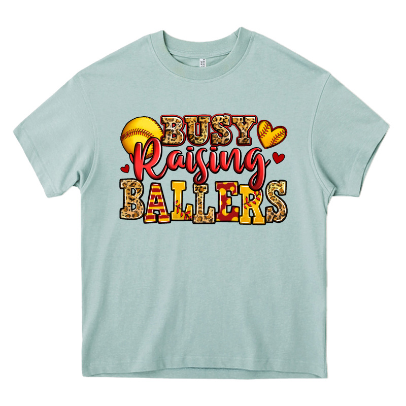Busy Raising Ballers Softball Heavy Core Tee by Jasminsmagicworld | Teevron