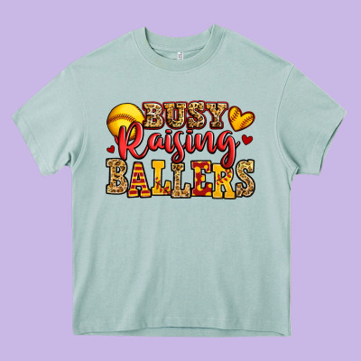 Busy Raising Ballers Softball Heavy Core Tee Designed By Jasminsmagicworld