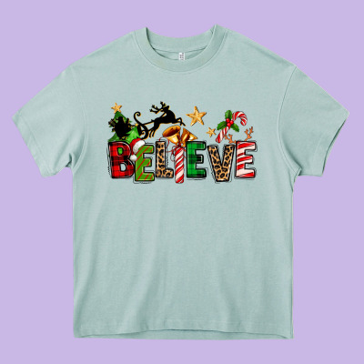 Christmas Believe Heavy Core Tee Designed By Texasbilliewilder