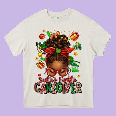 Santas Favorite Caregiver Afro Messy Bun Heavy Core Tee Designed By Texasbilliewilder