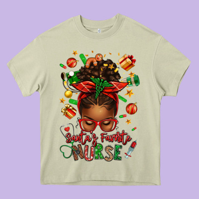 Santa's Favorite Nurse Afro Messy Bun Heavy Core Tee Designed By Texasbilliewilder