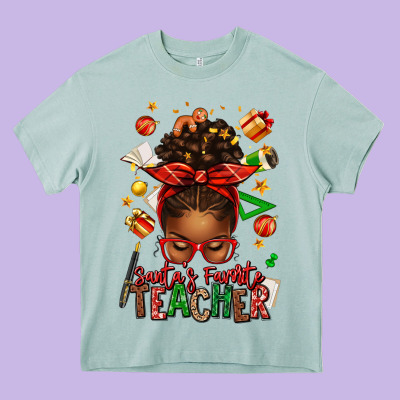 Santa's Favorite Teacher Afro Messy Bun Heavy Core Tee Designed By Texasbilliewilder