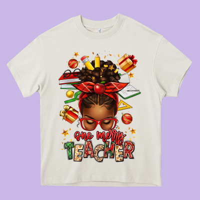 One Merry Teacher Afro Messy Bun Heavy Core Tee Designed By Texasbilliewilder