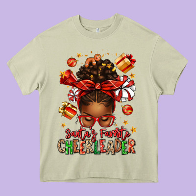 Santa's Favorite Cheerleader Afro Messy Bun Heavy Core Tee Designed By Texasbilliewilder
