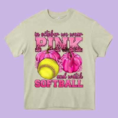 In October We Wear Pink And Watch Softball Heavy Core Tee Designed By Texasbilliewilder