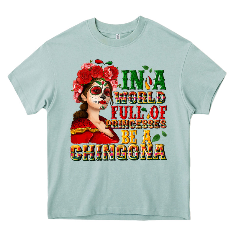 In A World Full Of Princesses Be A Chingona Heavy Core Tee by NancyCooperArtShop | Teevron