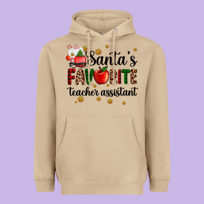 Santa's Favorite Teacher Assistant Heavyweight Hoodie Designed By Adodesignshop