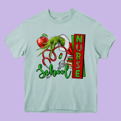 Christmas Character Nurse Heavy Core Tee Designed By Nancycooperartshop