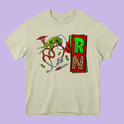 Christmas Character  Nurse Heavy Core Tee Designed By Nancycooperartshop