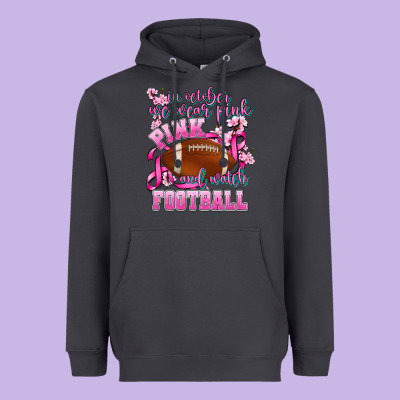In October We Wear Pink And Watch Football Heavyweight Hoodie Designed By Adodesignshop