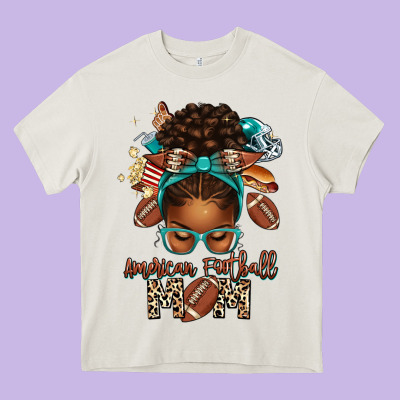 American Football Mom Afro Messy Bun Heavy Core Tee Designed By Texasbilliewilder