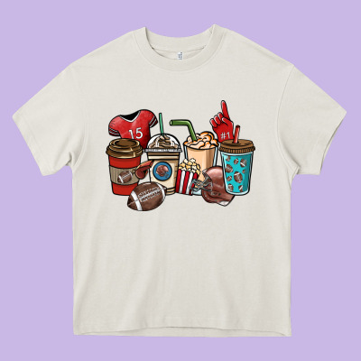 Football Coffee Cups Heavy Core Tee Designed By Nancycooperartshop