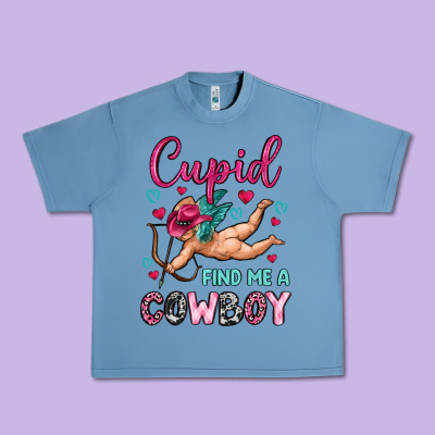 Cupid Find Me A Cowboy Urban Heavy Tee Designed By Oliviacreatesart