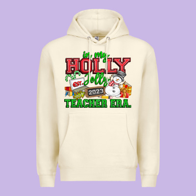 In My Holly Jolly Teacher Era Premium Hoodie Designed By Cowhidedigitalart