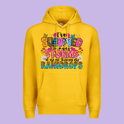 Ive Survived Too Many Storms To Be Thered By Raind Premium Hoodie Designed By Cowhidedigitalart