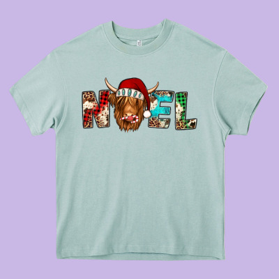 Noel Highland Cow Heavy Core Tee Designed By Jasminsmagicworld