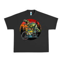 Pigment Black t rex dinosaur riding bicycle with retro forest sunset Urban Heavy Tee - RanaPortraitStore