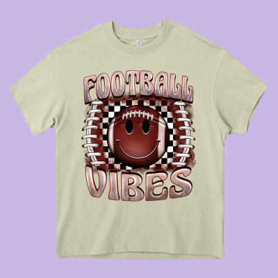 Football Vibes Smiley Face Heavy Core Tee Designed By Barkaloodesign