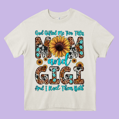 God Gifted Me Two Titles Mom And Gigi  And I Rock Them Both Heavy Core Tee Designed By Jahusdesignshop