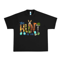 Black The hunt is on with eggs Easter Day Urban Heavy Tee - HowdyJamesFarm