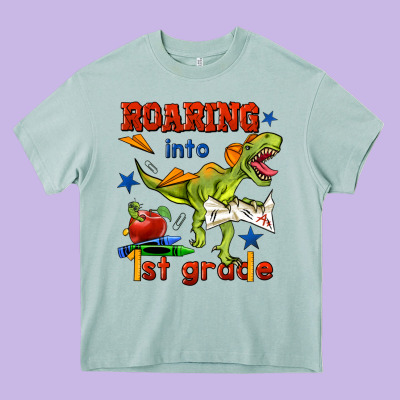 Roaring Into 1st Grade Heavy Core Tee Designed By Bundleandbundleshop