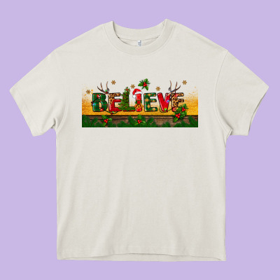 Christmas Believe Heavy Core Tee Designed By Bundleandbundleshop