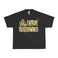 Pigment Black Egg hunter with plate letters Easter Day Urban Heavy Tee - HowdyJamesFarm