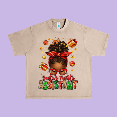 Santa's Favorite Assistant Afro Messy Bun Urban Heavy Tee Designed By Texasbilliewilder