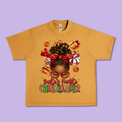 Santa's Favorite Cheerleader Afro Messy Bun Urban Heavy Tee Designed By Texasbilliewilder