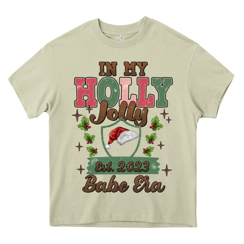 In My Holly Jolly Babe Era Heavy Core Tee by MaliasSmallBusiness | Teevron