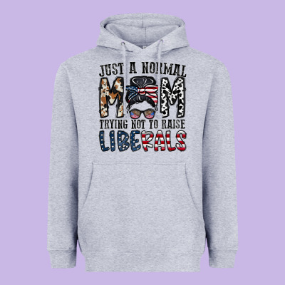 Just A Regular Mom Trying Not To Raise Liberals Heavyweight Hoodie Designed By Cowhidedigitalart