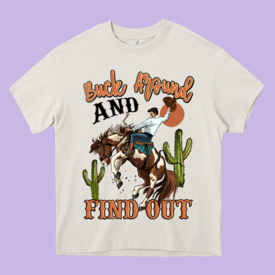 Buck Around And Find Out Rodeo Cowboy Heavy Core Tee Designed By Maliassmallbusiness
