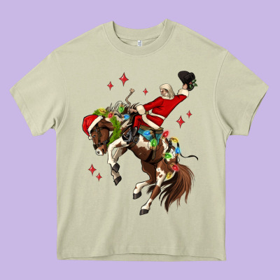 Christmas Cowboy Santa Heavy Core Tee Designed By Maliassmallbusiness
