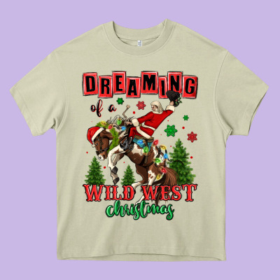 Dreaming Of A Wild West Christmas Cowboy Santa Heavy Core Tee Designed By Maliassmallbusiness