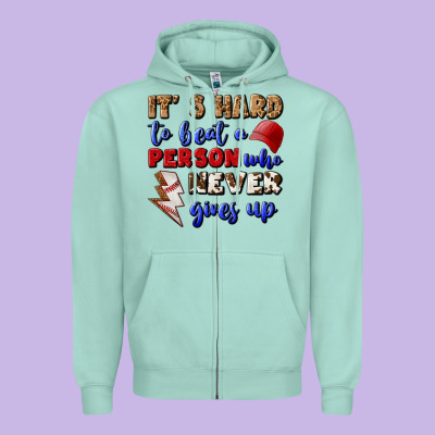 It's Hard To Beat A Person Who Never Gives Up Zipper Hoodie Designed By Bundleandbundleshop