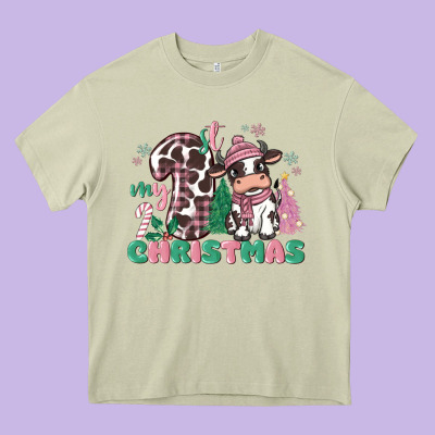 My First Christmas Cow Heavy Core Tee Designed By Maliassmallbusiness