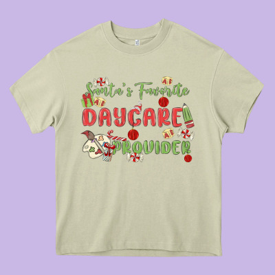 Santa's Favorite Daycare Provider Heavy Core Tee Designed By Maliassmallbusiness