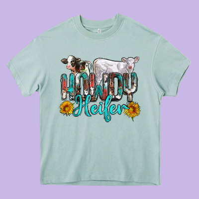 Western Howdy Heifer Heavy Core Tee Designed By Nancycooperartshop
