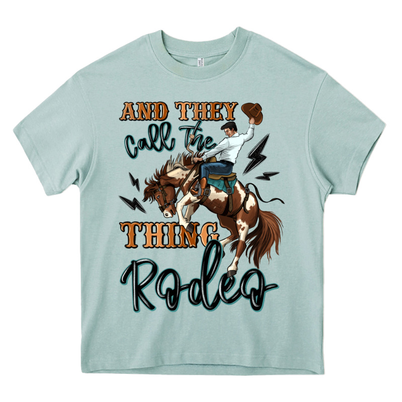 And They Call The Thing Rodeo Cowboy Heavy Core Tee by MaliasSmallBusiness | Teevron