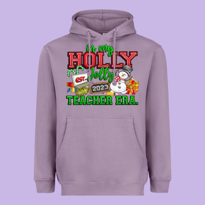 In My Holly Jolly Teacher Era Heavyweight Hoodie Designed By Cowhidedigitalart