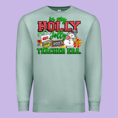 In My Holly Jolly Teacher Era Premium Sweatshirt Designed By Cowhidedigitalart