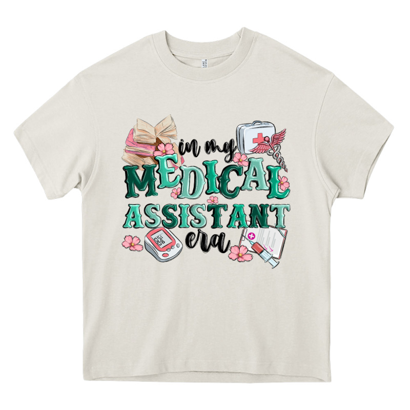 In My Medical Assistant Era Heavy Core Tee by MaliasSmallBusiness | Teevron