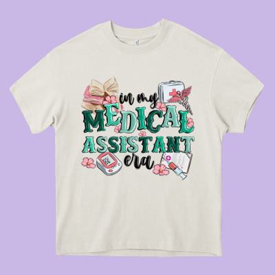 In My Medical Assistant Era Heavy Core Tee Designed By Maliassmallbusiness