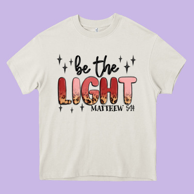 Be The Light Heavy Core Tee Designed By Maliassmallbusiness