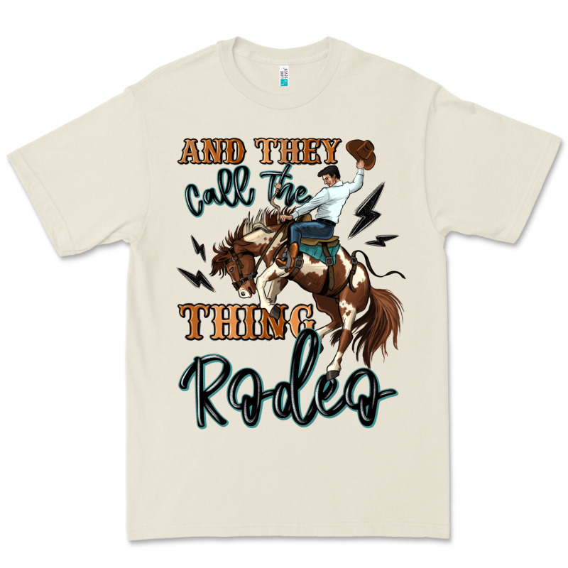 And They Call The Thing Rodeo Cowboy Premium Tee by MaliasSmallBusiness | Teevron