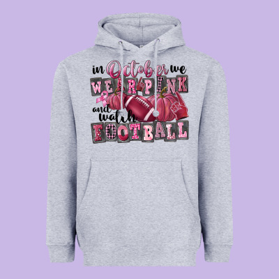 In October We Wear Pink And Watch Football Heavyweight Hoodie Designed By Fadigitalartstudio