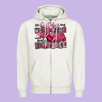 In October We Wear Pink And Watch Football Zipper Hoodie Designed By Fadigitalartstudio