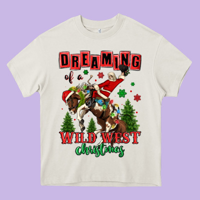 Dreaming Of A Wild West Christmas Cowboy Santa Heavy Core Tee Designed By Maliassmallbusiness
